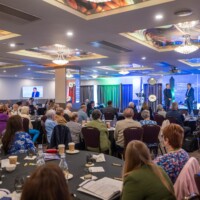 Professor Ronan Collins - SDCC Age Friendly Ambassador speaking with Brendan Courtney - Master of Ceremonies at the National Older People's Council Convention 2025 at the Maldron Hotel, Tallaght