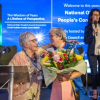 Ita Healy - Chair of the National Network of Older People’s Councils presents flowers to Mary Lyons - Chair of South Dublin Older People's Council at Day 2 of the National Older People's Council Convention 2025 at the Maldron Hotel, Tallaght