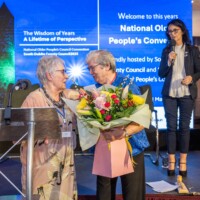 Ita Healy - Chair of the National Network of Older People’s Councils presents flowers to Mary Lyons - Chair of South Dublin Older People's Council at Day 2 of the National Older People's Council Convention 2025 at the Maldron Hotel, Tallaght