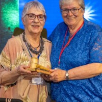 Handing over of Gavel - Ita Healy - Chair of the National Network of Older People’s Councils is presented with the gavel by Mary Lyons - Chair of South Dublin Older People's Council at Day 2 of the National Older People's Council Convention 2025 at the Maldron Hotel, Tallaght